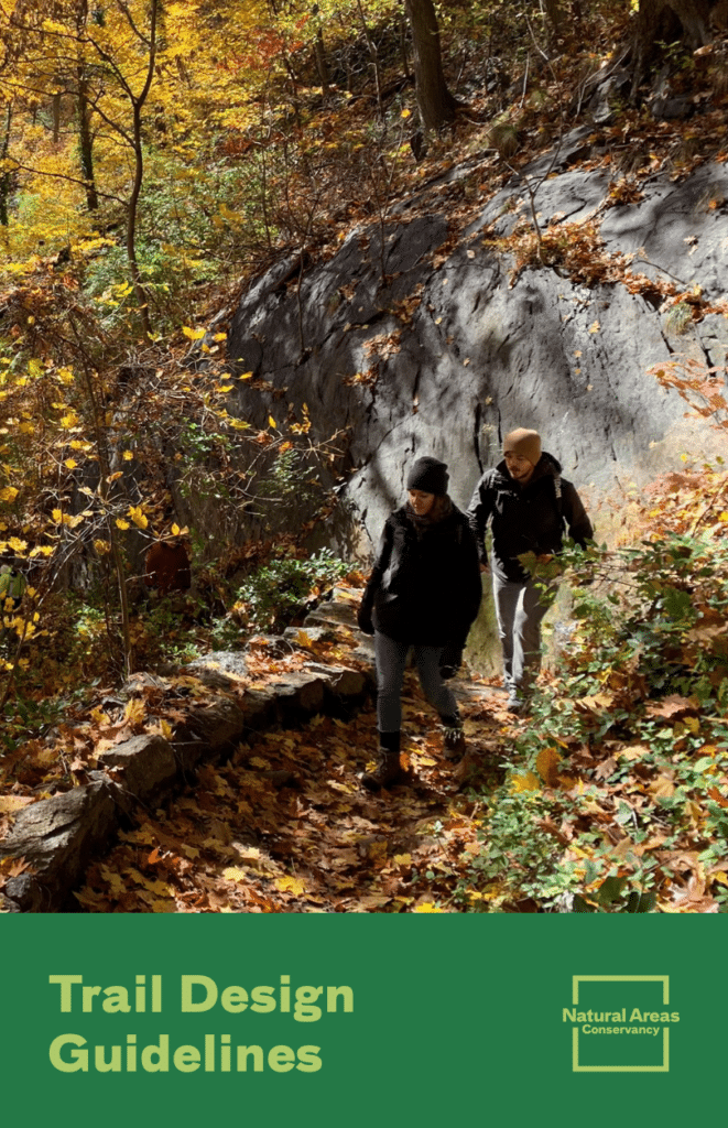 cover of trails guidelines; two people walking on fall trail in forest